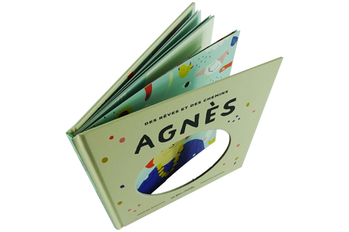 Die-cut hardcover book A white children's hardcover book with a die-cut in the middle